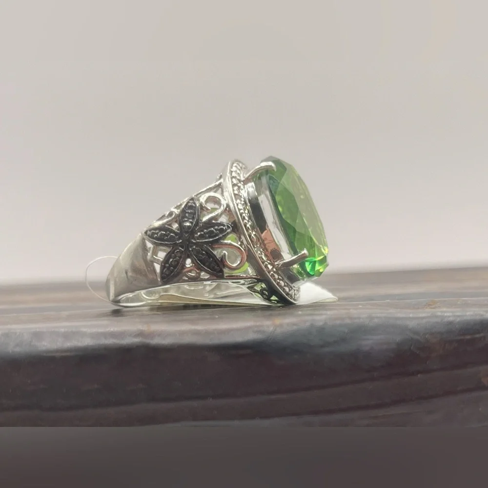 Simulated peridot in sterling silver with black rhinestone accents